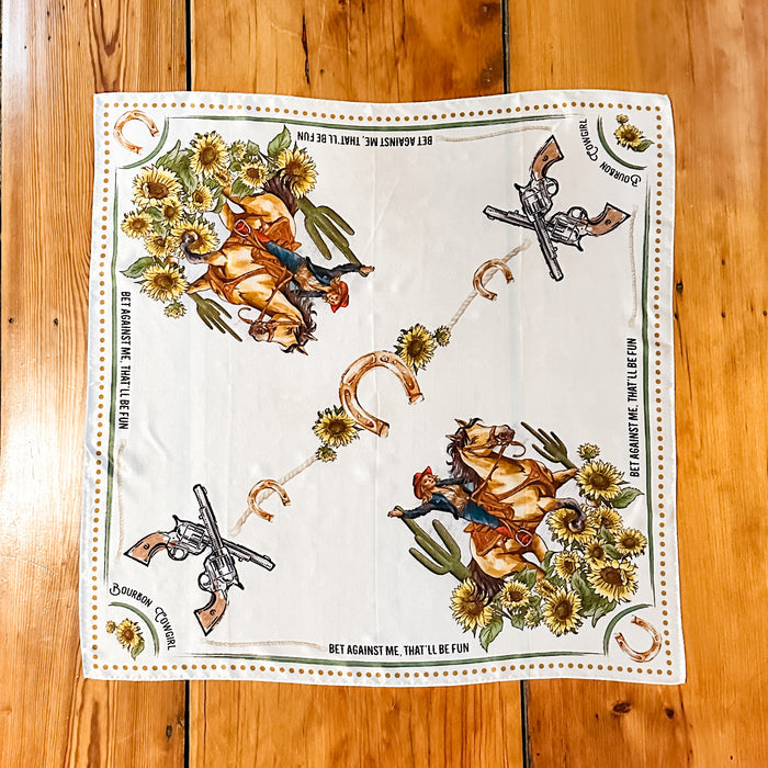 White scarf with cowboy and floral print.