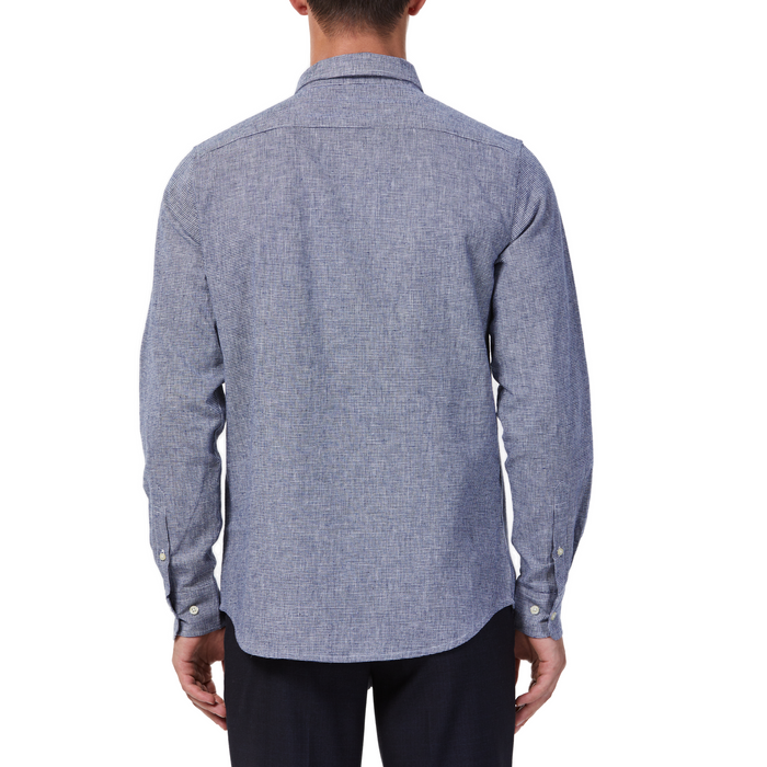 Men's navy and white mini houndstooth patterned linen blend, long sleeve button up shirt with a pointed collar on a model. Image is cropped to the torso and a back view of the shirt