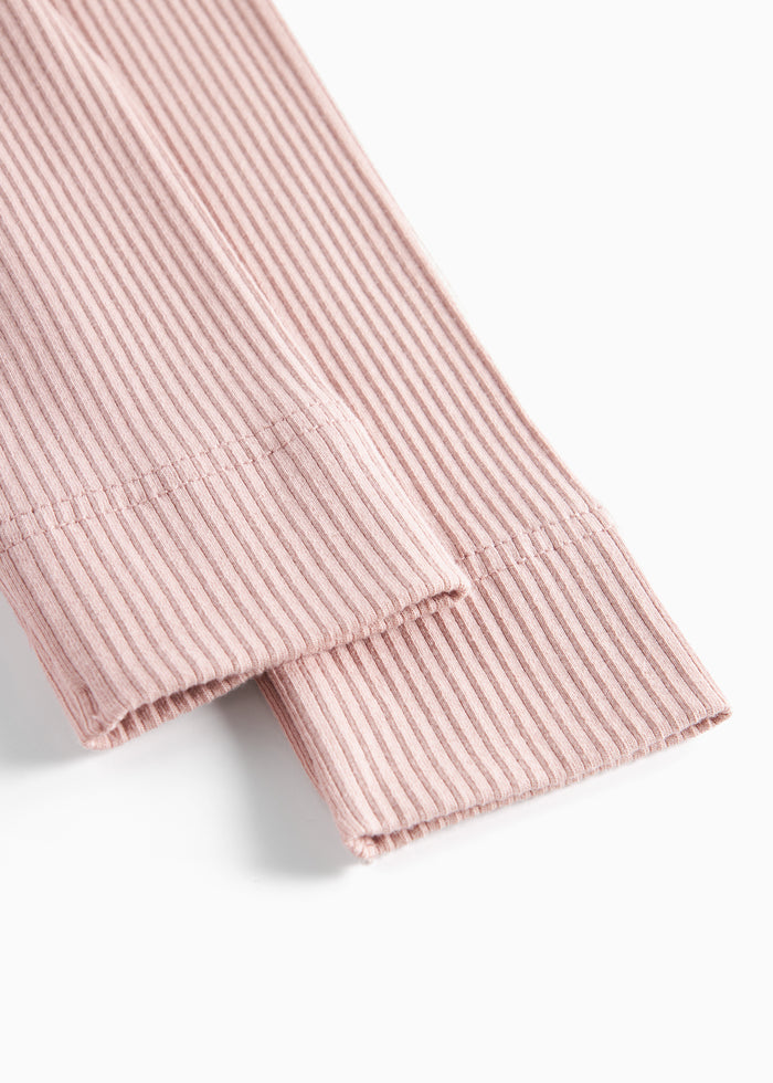 Detail of legs on pink leggings for children