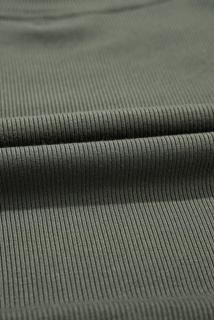 Close-up of ribbed fabric texture for casual plus size long sleeve blouse in olive green