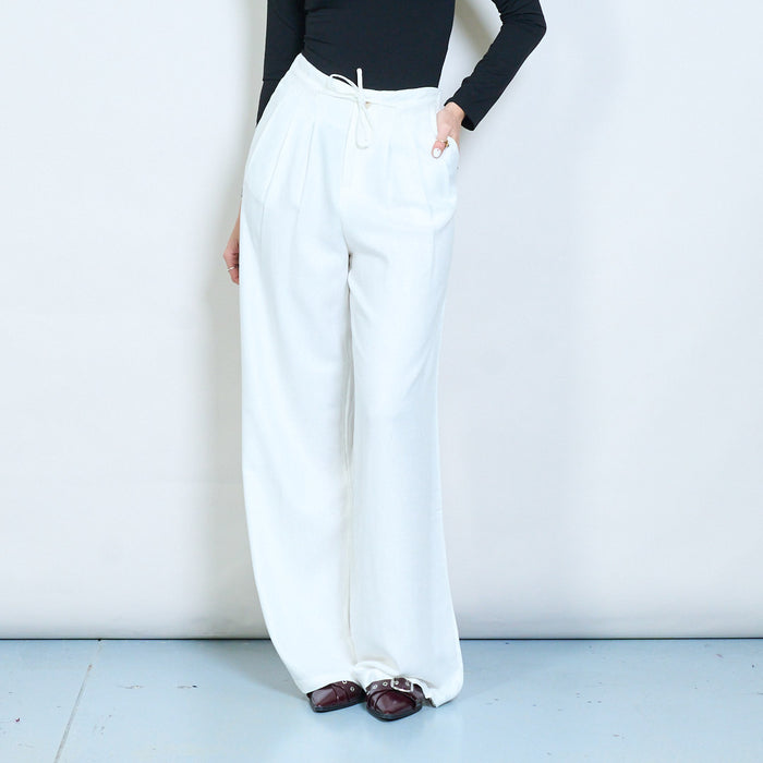 Pleated wide leg trousers with front button and tie detail wholesale