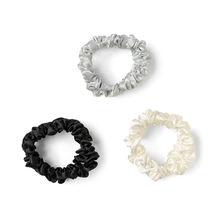 Set of three DM Merchandising satin scrunchies in black white and silver for hair styling