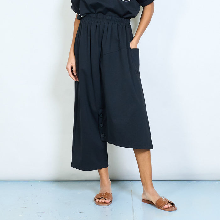 Asymmetric hem elastic waist midi skirt with front buttons wholesale