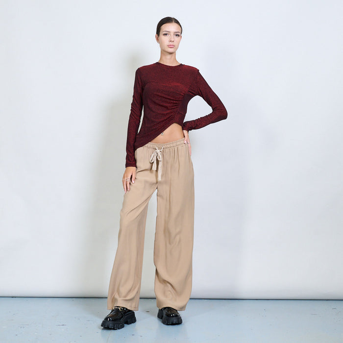 Asymmetric ruched glitter long sleeve top wholesale