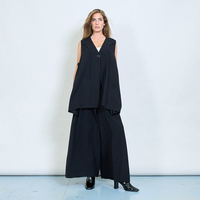 Asymmetric sleeveless vest with ruched tie details wholesale