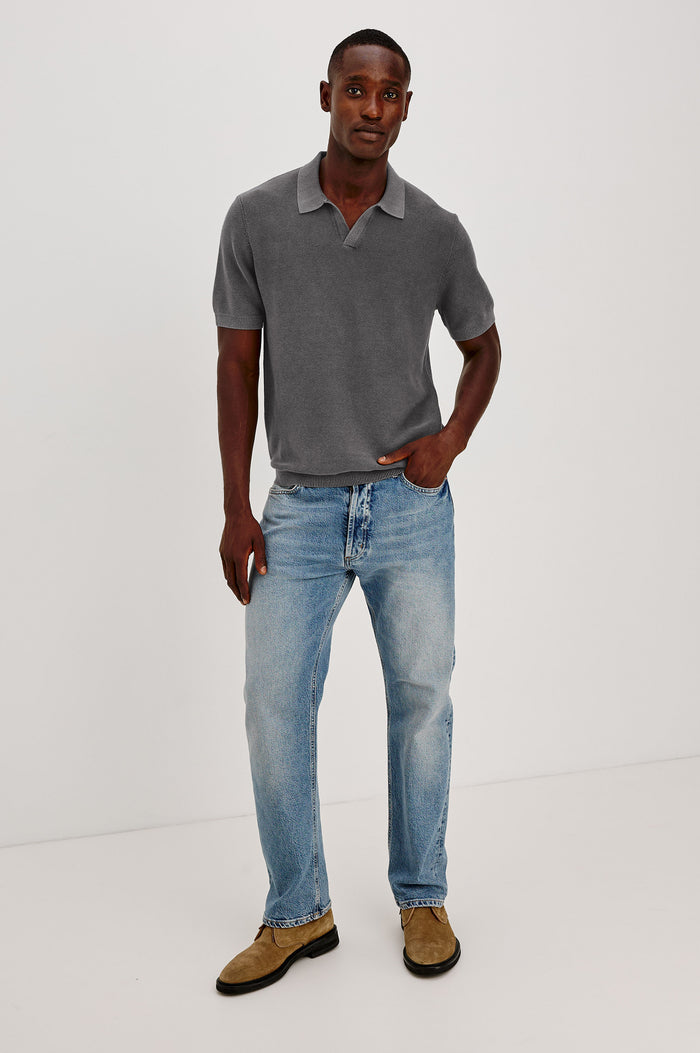 Baker Polo Shirt in Cotton Knit With Sun-Washed Effect, Open-Placket Collar, Short Sleeves, and Relaxed Fit in Sunfaded Black Colorway - Full Body Front View Featured on Model