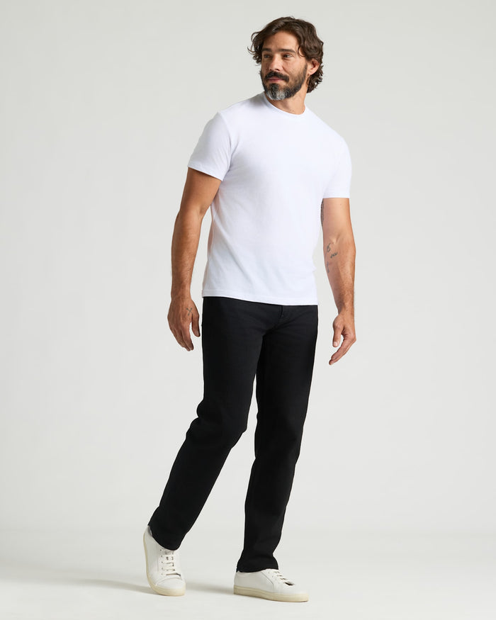 Man wearing Black Wash Straight Authentic Denim Jeans.