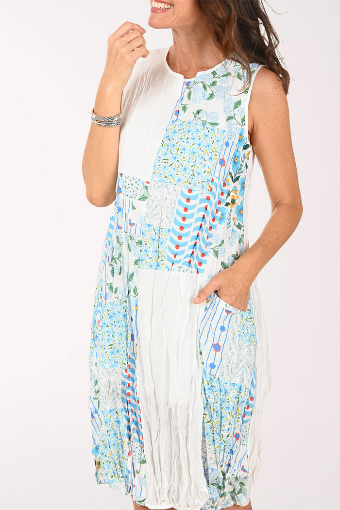 Woman wearing a colorful dress on a white background