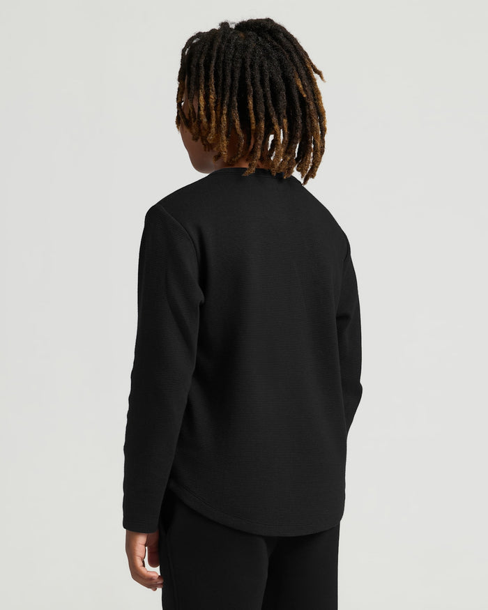 Boys' All Black Waffle Long Sleeve Henley worn by model.