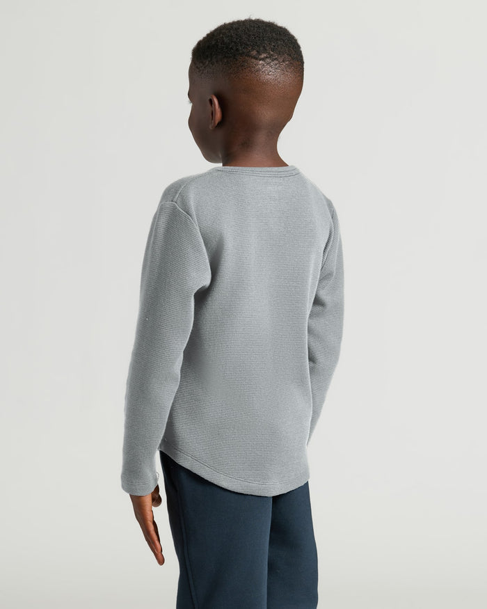 Boy wearing Boys Heather Gray Long Sleeve Waffle Henley, back view.