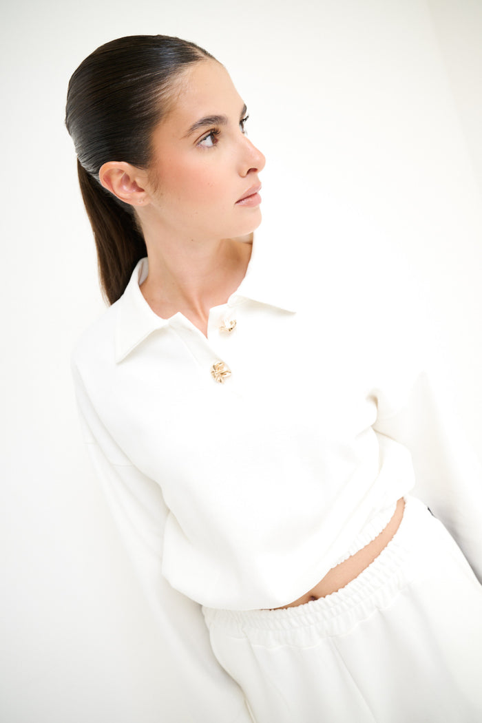 Cropped polo sweatshirt with gold button detail wholesale