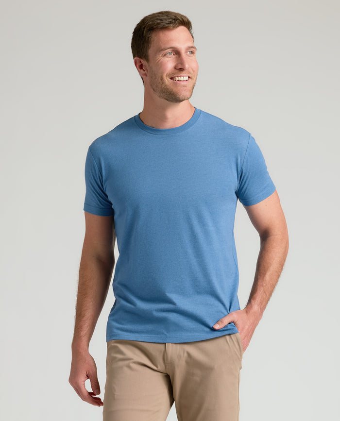 Man wearing Classic Crew Neck T-shirt, smiling casually.