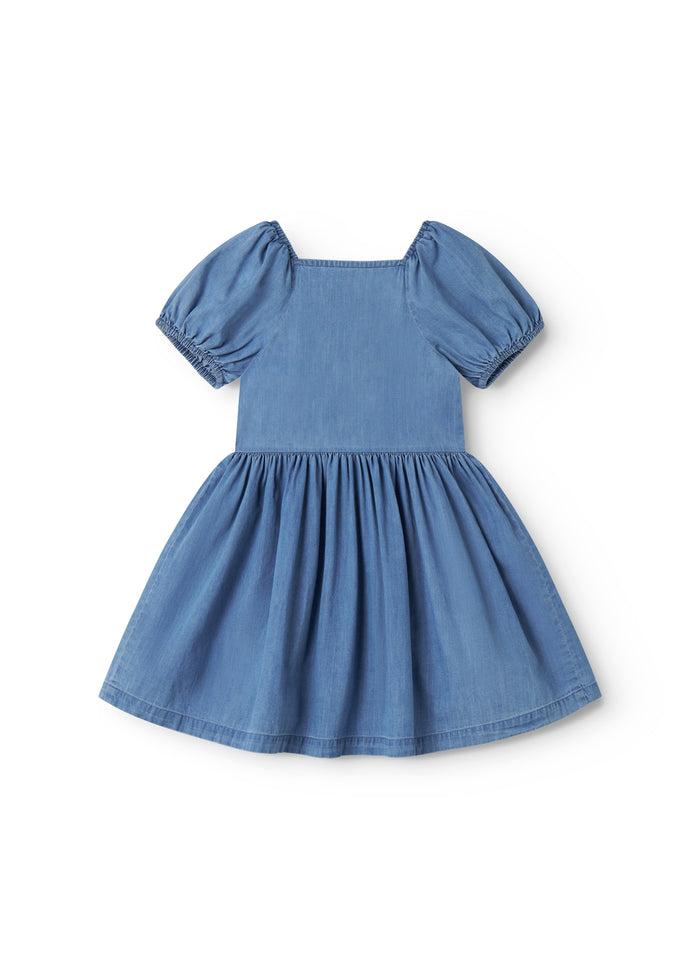 Blue children's dress with puff sleeves, pockets, and a button closure.