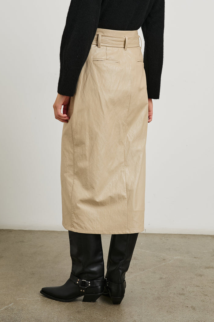 Edem Midi Skirt with a Tie Belt, a Center Slit, Four Button Closure at the Waist, Two Front Pockets Each Overlaid with a Button Flap Pocket and Two Back Welt Pockets in Dune Colorway, with Dark Brown Buttons - Back View Featured on Model
