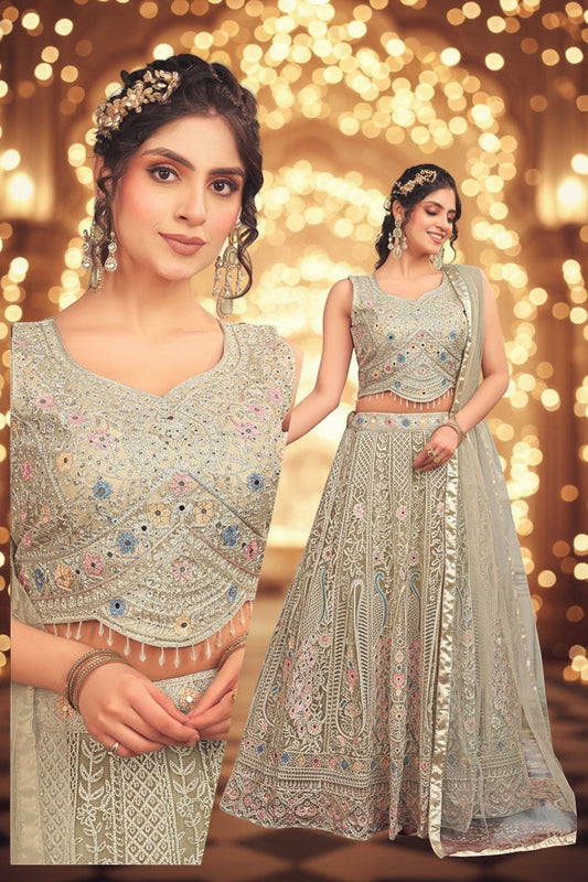 Kurti Connection USA sage lehenga choli with multi-colored floral embroidery, mirror work, and scalloped beaded hem.