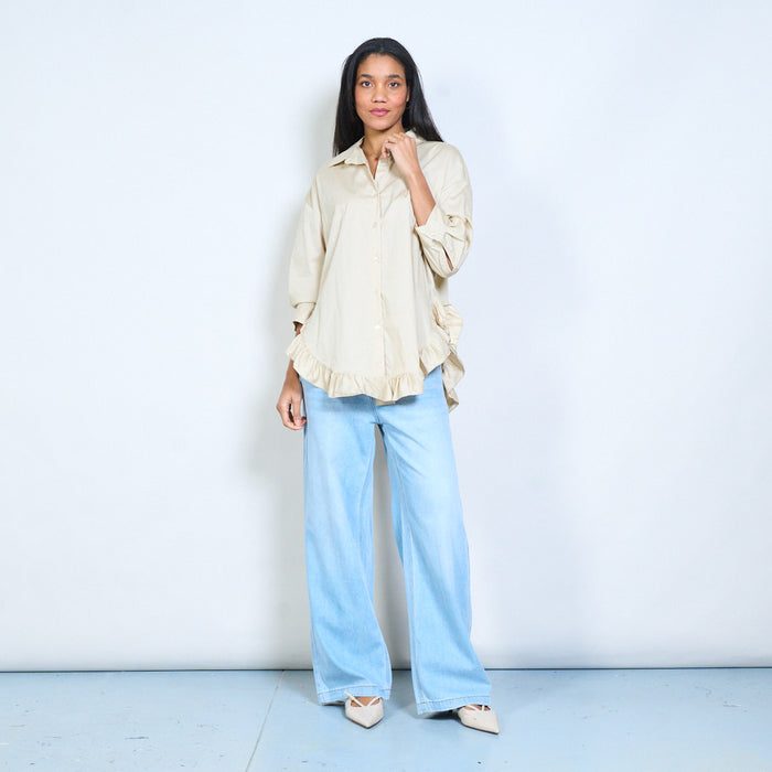 Flowy button-front shirt with ruffled hem detail and classic collar wholesale