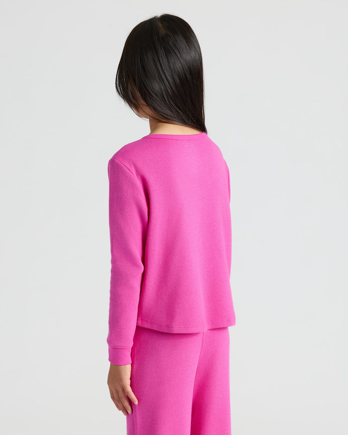 Person wearing Girls Electric Fuchsia Waffle Long Sleeve Henley & Pants.