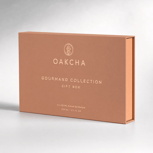 Three-quarter view of Gourmand Collection Gift Box Set showcasing a peach box with Oakcha logo and white GOURMAND COLLECTION text on a gray background