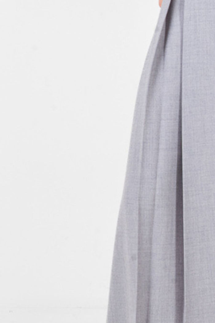 High waist pleated maxi skirt with subtle check pattern and fluid silhouette wholesale