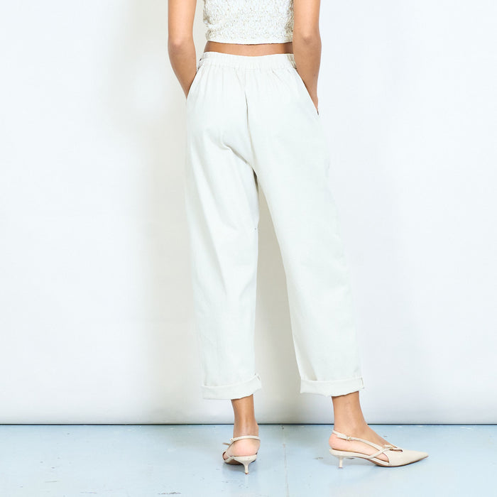 High waist pleated tapered trousers with decorative side buckle detail wholesale