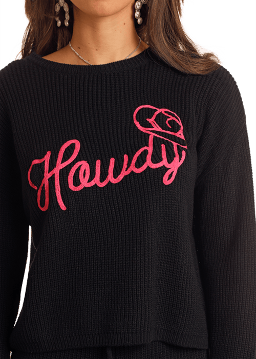 Black sweater with pink Howdy graphic.