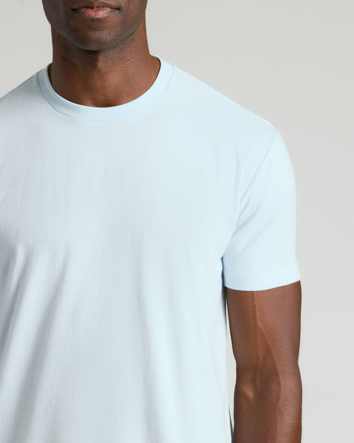 Person wearing Icicle Classic Crew Neck T-shirt, light-blue, short-sleeve.