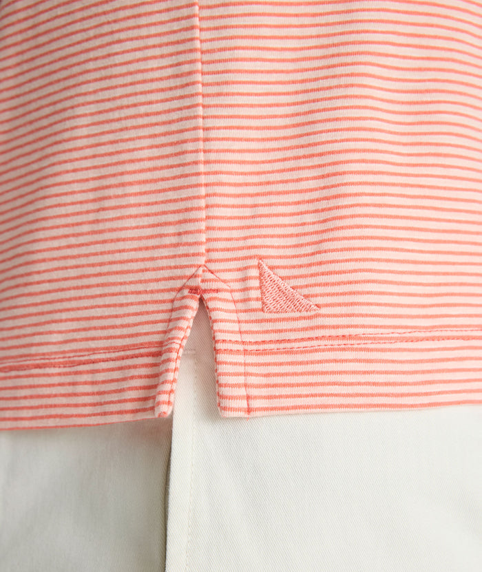Model is wearing UNTUCKit Belvoir polo in emberglow.