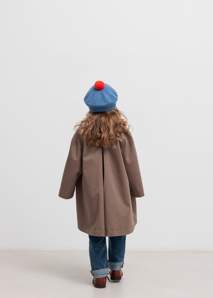 Children wearing khaki chino coat seen from behind