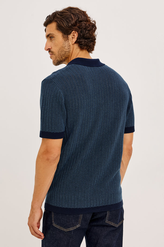 Langley Polo Shirt in Lightweight Contrast Open Birdseye Knit With Classic Fit, Open Collar, Short Sleeves, and Ribbed Trim in Navy Marine Ripple Colorway - Upper Body Back View Featured on Model