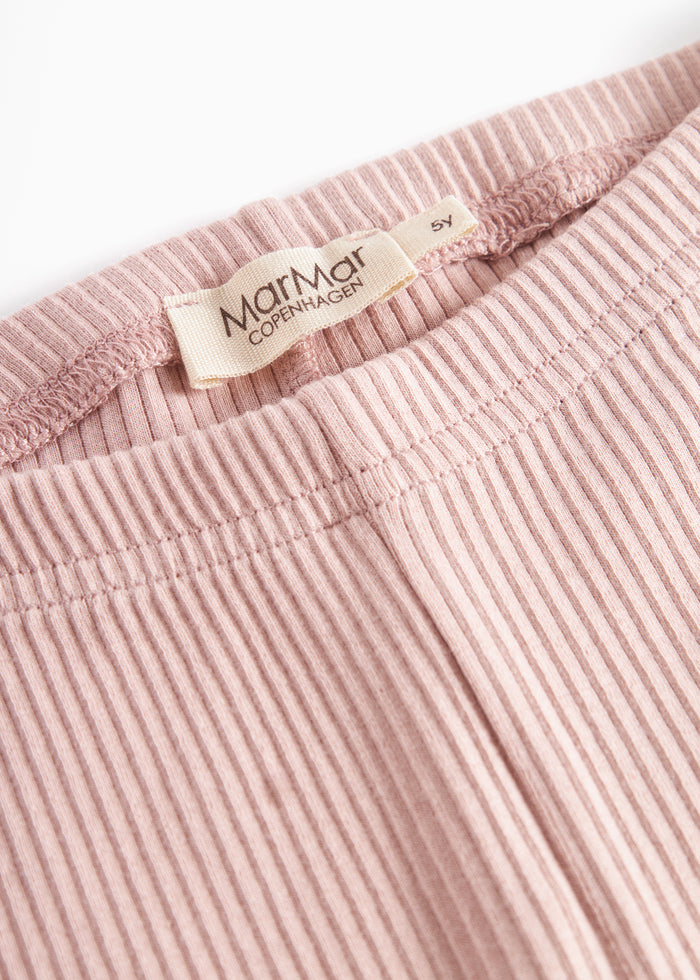 Close-up of elastic waist on pink leggings for children