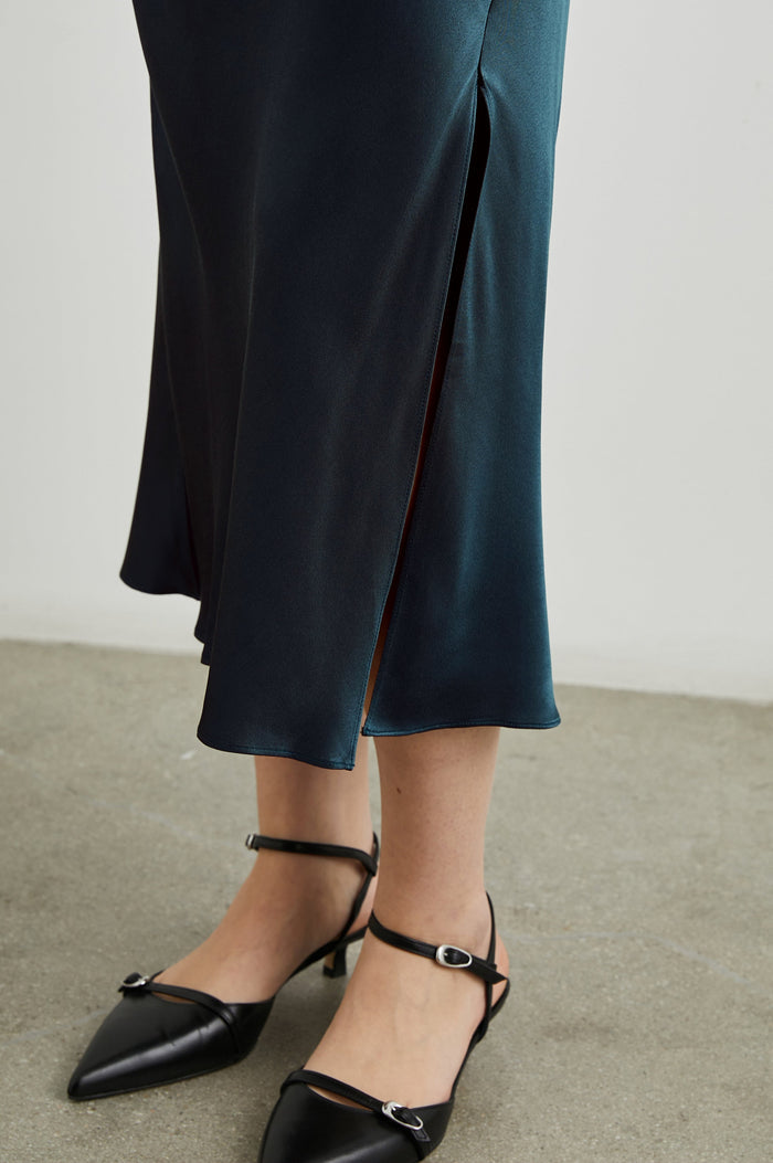 Maya Midi Skirt with Mid-Thigh Side Slit in Deep Sea Colorway - Front View Featured on Model