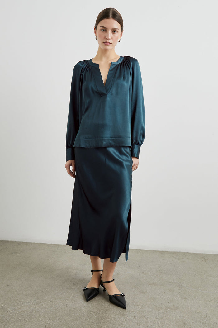 Maya Midi Skirt with Mid-Thigh Side Slit in Deep Sea Colorway - Front Full Body View Featured on Model