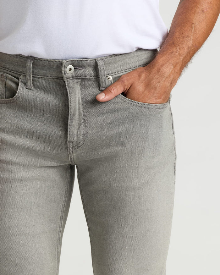 Medium Gray Wash Slim Authentic Denim Jeans with button closure and pocket detail.