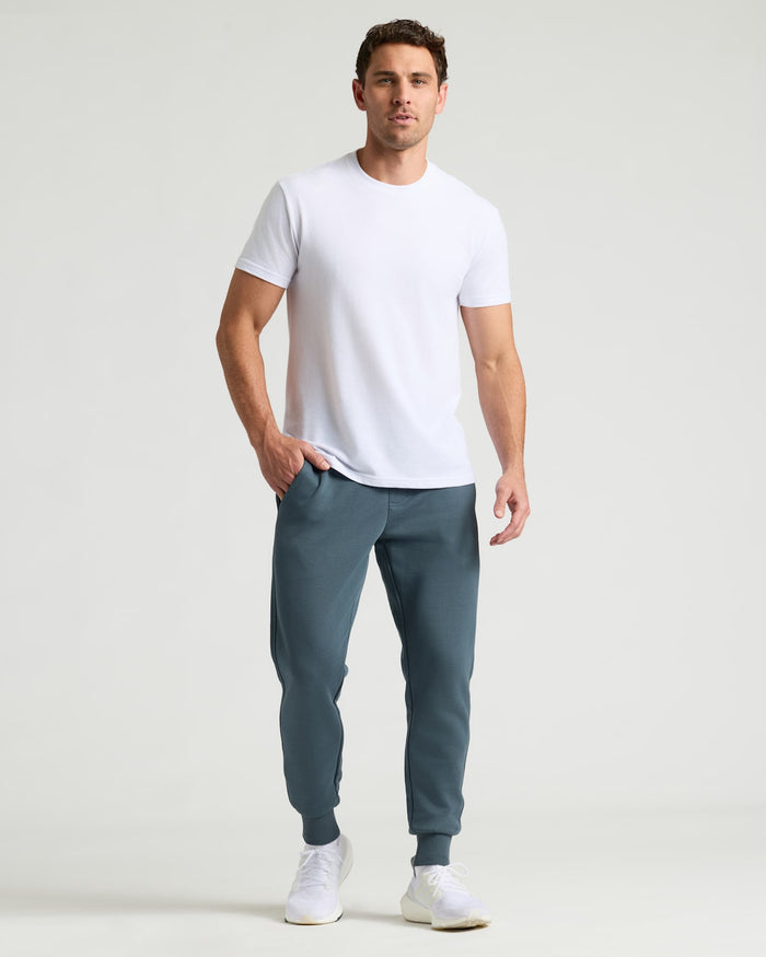 Neptune Fleece French Terry Joggers on male model with white T-shirt.