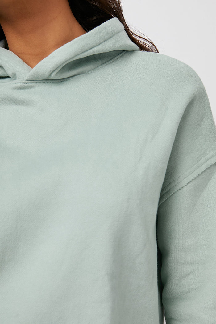 Nico & Edna Set with a Sweatshirt with a Hood and Pants with Two Large Front Pockets and One Back Patch Pocket in Light Seafoam Colorway - Front View Featured on Model