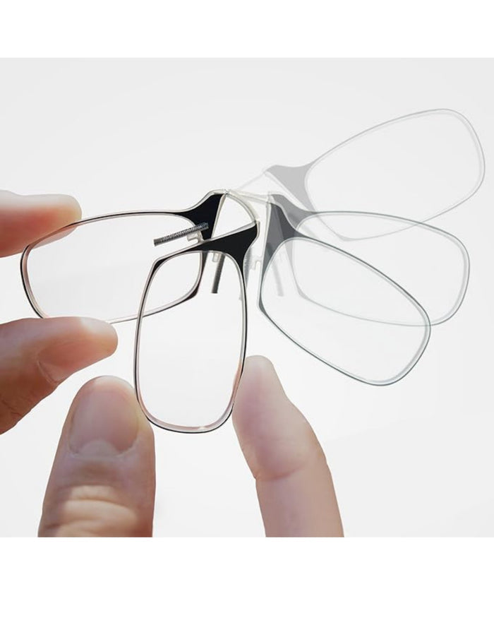 Close-up of rimless nose clip reading glasses with black pinch nose pads