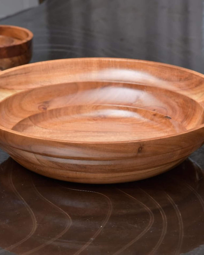 Wooden salad bowl with shallow interior and smooth carved wood grain