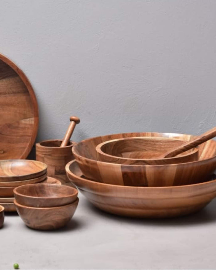 Wooden serving bowl set with matching spoons, stacked bowls in natural wood