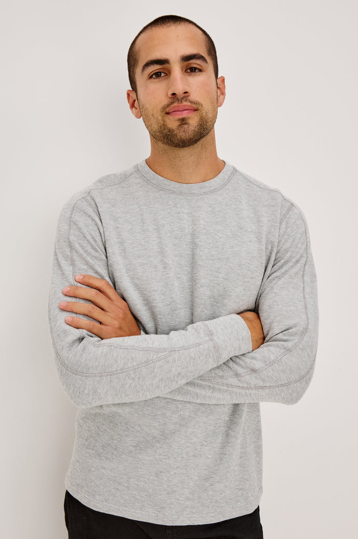 Rheese Long Sleeve Tee in French Rib Cotton With Crew Neckline, Classic Fit, and Seam Detailing in Grey Heather Colorway - Upper Body Front View Featured on Model