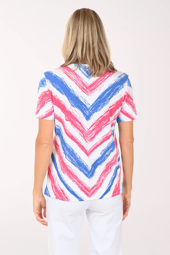Woman wearing a colorful striped shirt on a white background