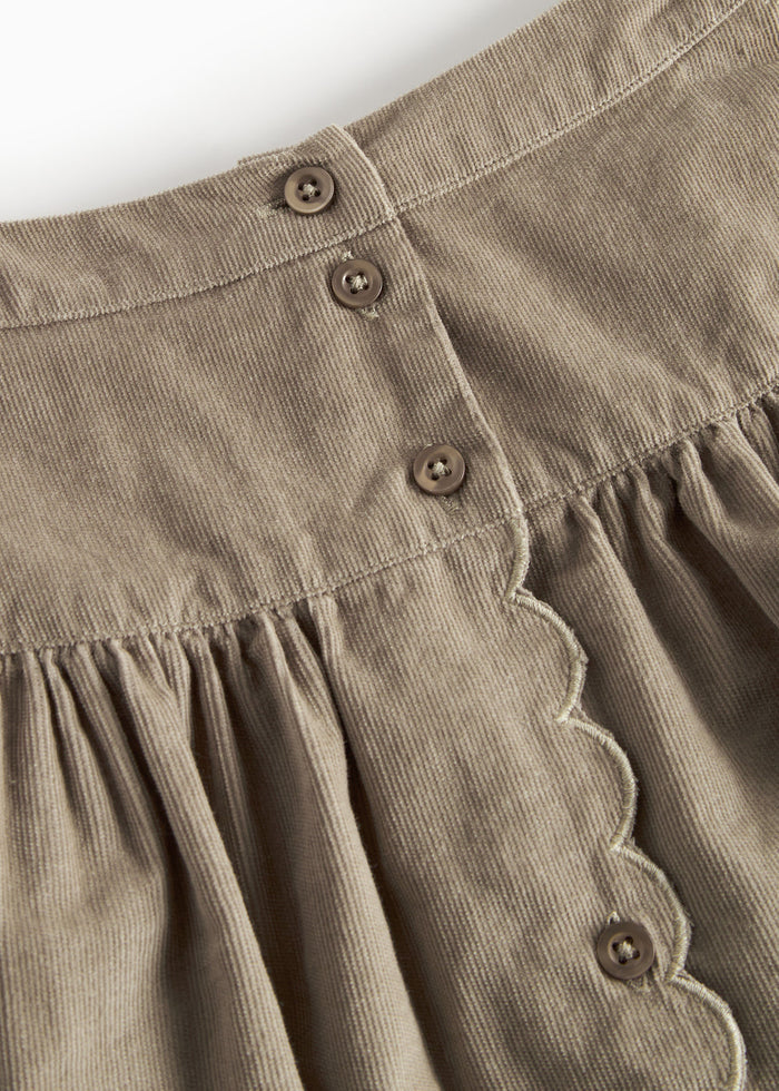 Beige skirt in baby velvet with buttons and wavy edge for children