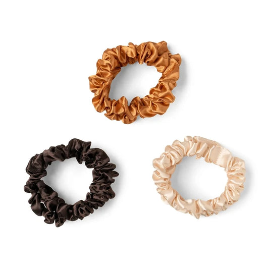 Set of three satin scrunchies in brown, black, and beige for gentle hair styling by DM Merchandising