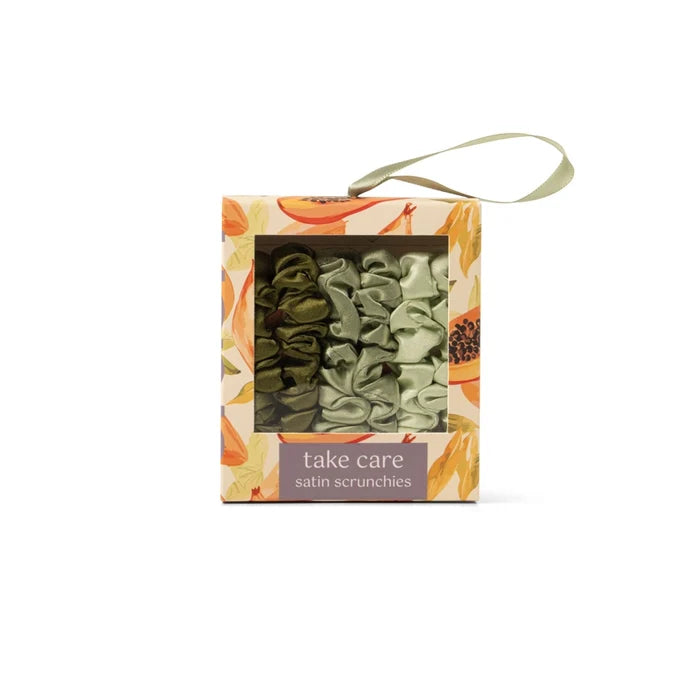 DM Merchandising satin scrunchies set in olive green and light green with floral packaging and carrying loop