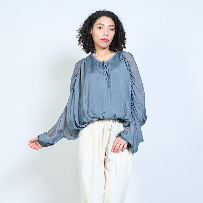 Sheer ruched sleeve tie-neck blouse with smocked hem wholesale