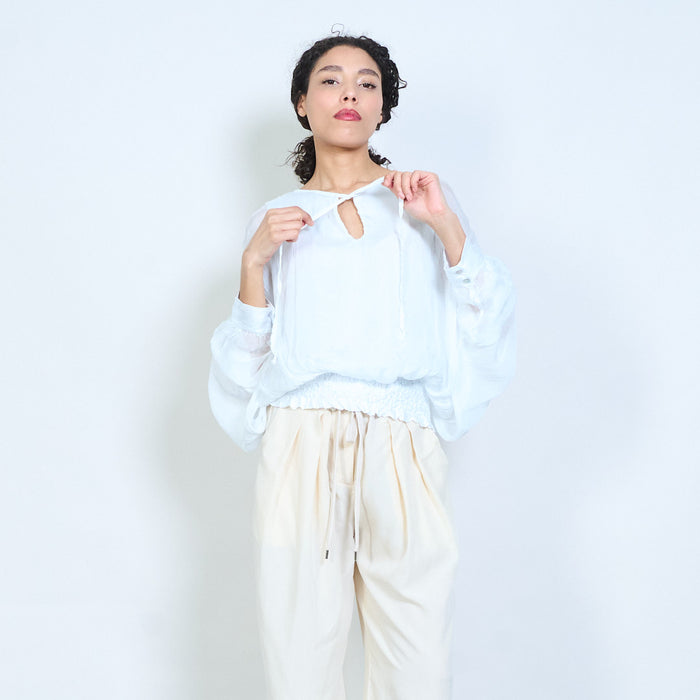 Sheer ruched sleeve tie-neck blouse with smocked hem wholesale