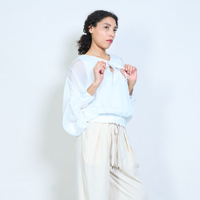 Sheer ruched sleeve tie-neck blouse with smocked hem wholesale
