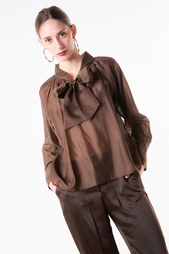 Sheer satin bow tie neck blouse with gathered neckline and elastic hem wholesale