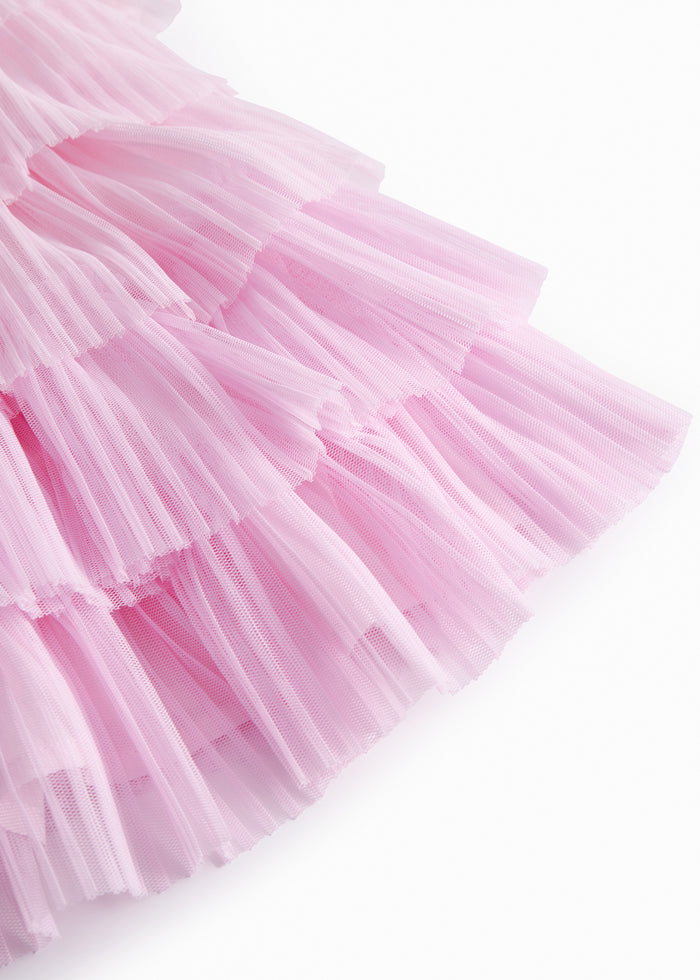 Red lower part for children in light, pleated tyl with multiple layers.