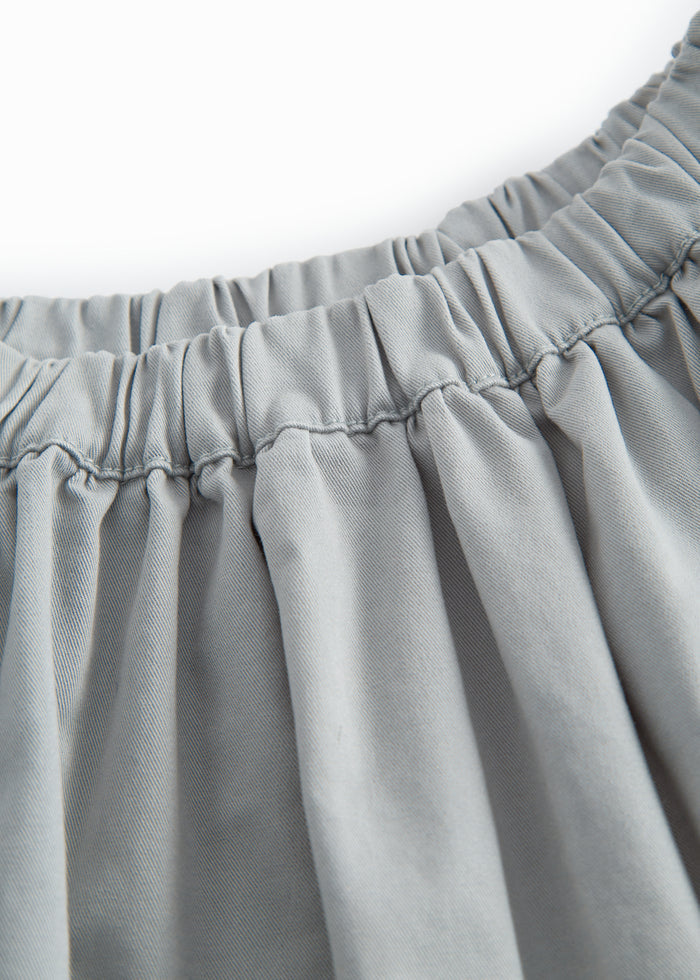 Blue chino pants for children with a wide fit.