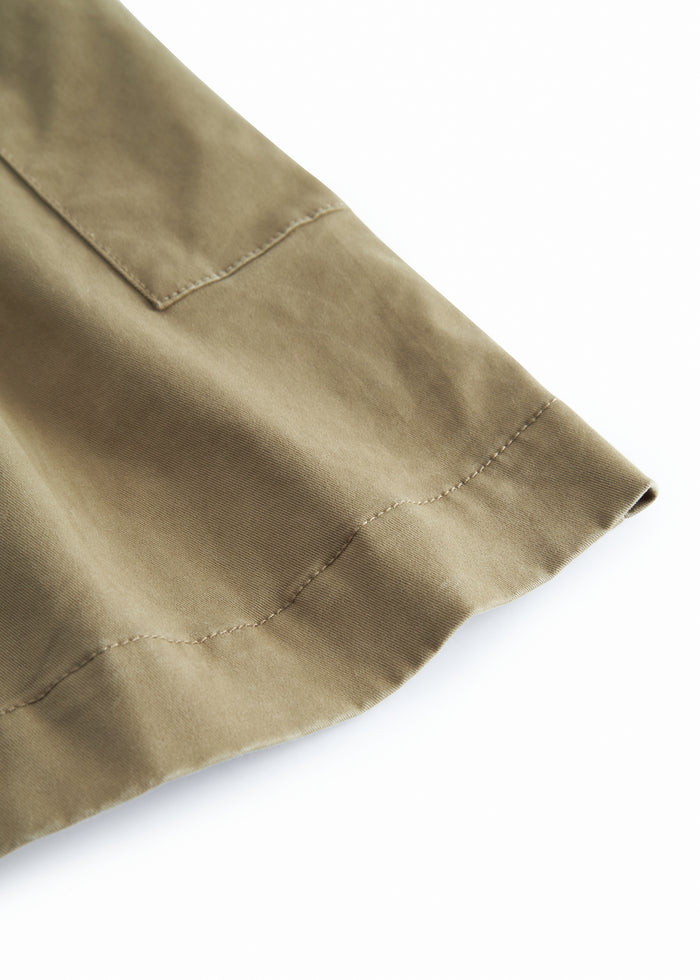 Green chino pants for children with a wide fit.